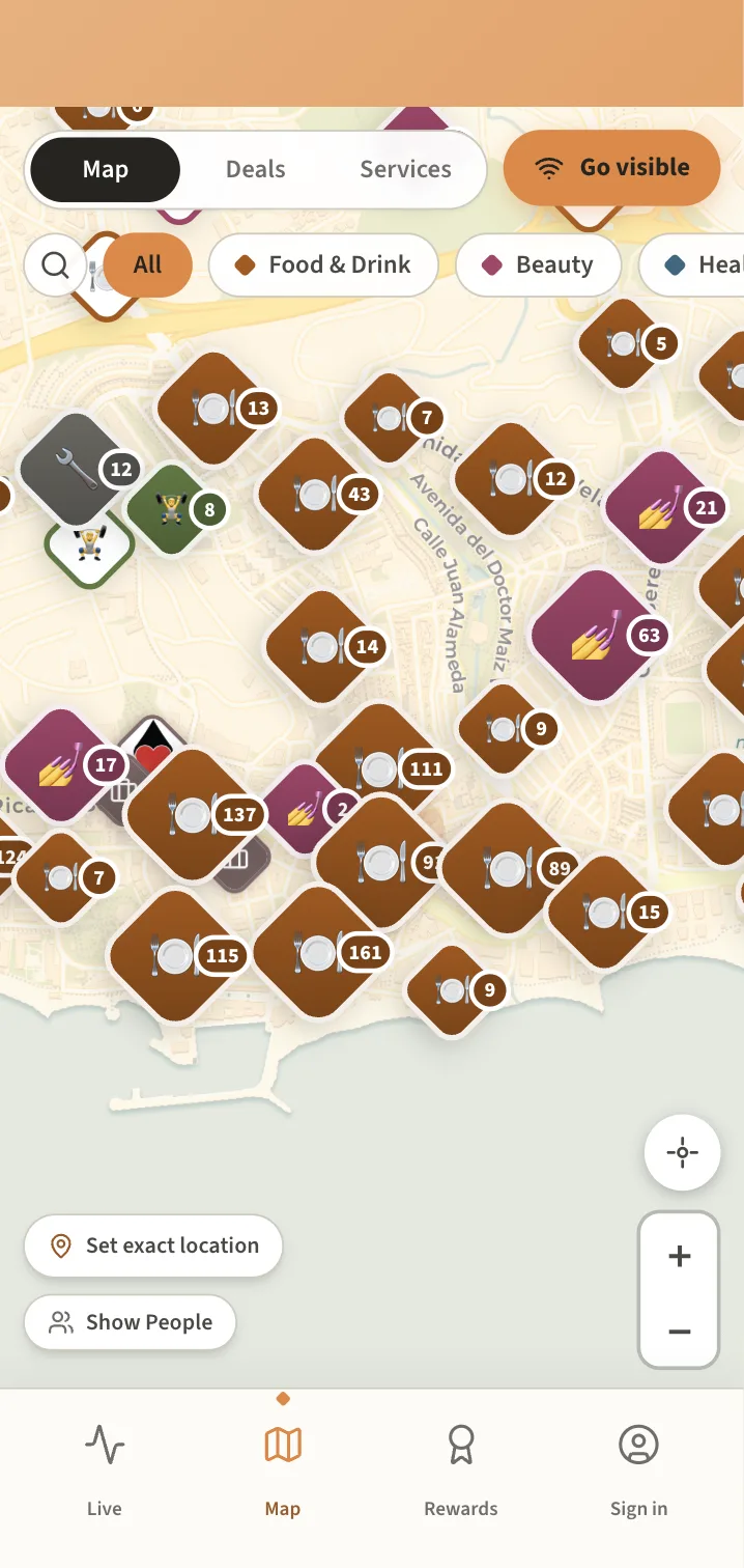 The Nexyo app showing live businesses on the map around Marbella